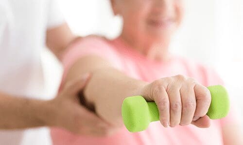 elderly lady doing physical therapy 